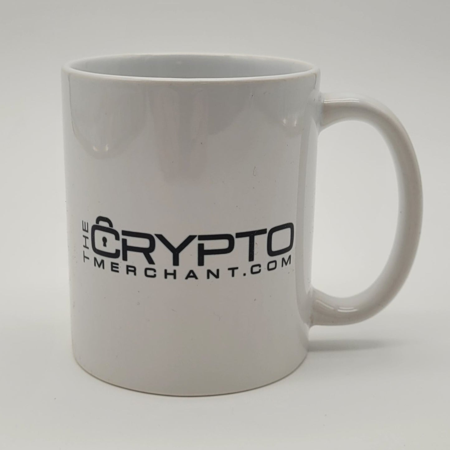 White mug with 'Crypto' branding on a light gray background